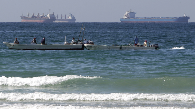 European countries have agreed to stop importing Iranian oil as of Sunday. This could make it harder for Iran to find markets for its crude. Iran has been filling up tankers off its coast, but analysts say it could run out of storage capacity. This photo shows oil tankers off Iran's coast in January.