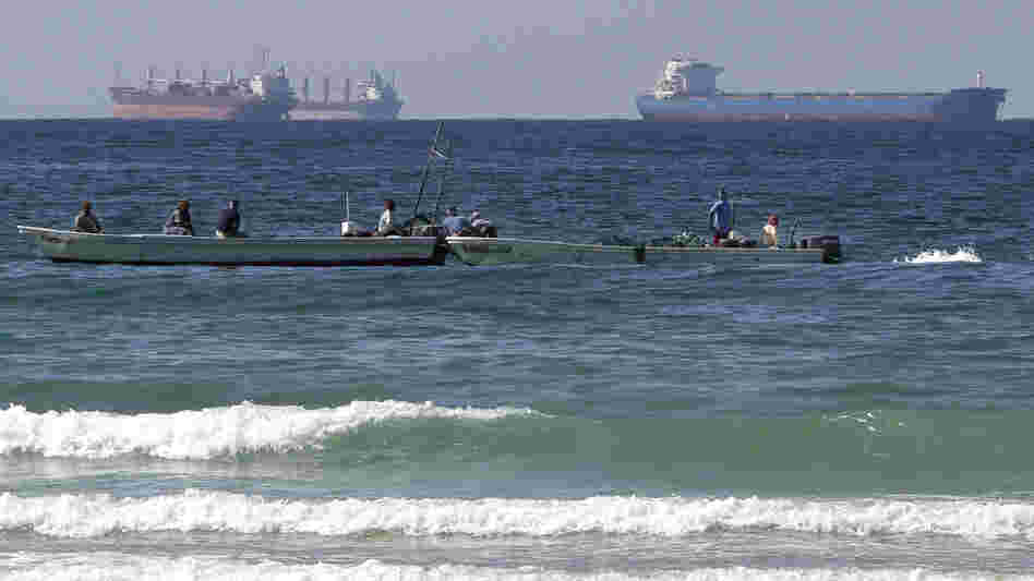 European countries have agreed to stop importing Iranian oil as of Sunday. This could make it harder for Iran to find markets for its crude. Iran has been filling up tankers off its coast, but analysts say it could run out of storage capacity. This photo shows oil tankers off Iran's coast in January.