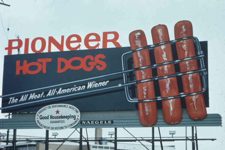 These Pioneer hot dogs look like they are going to jump off of this 1965 billboard and into your mouth.