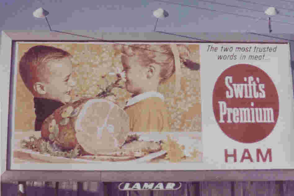 The Swift's Premium ham is front and center in the depiction of family holiday fun in this vintage billboard.
