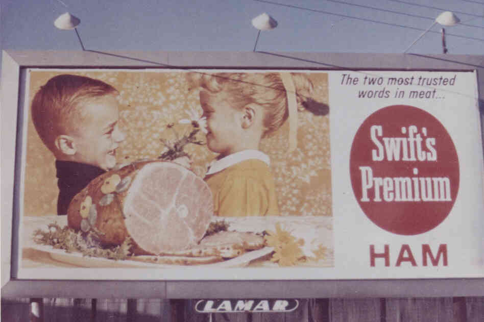 The Swift's Premium ham is front and center in the depiction of family holiday fun in this vintage billboard.