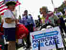 Susan Clark (left) argues with another protester about the Affordable Care Act outside the U.S. Supreme Court on Thursday.
