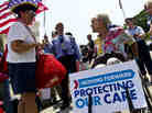 Susan Clark (left) argues with another protester about the Affordable Care Act outside the U.S. Supreme Court on Thursday.