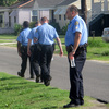 Sgt. Miro Brekalo talks with residents in New Orleans' Gentilly neighborhood, as other officers walk their beat. Their goal isn't only to stop crime; it's also to connect with citizens who are often reluctant to report crimes. Sgt. Miro Brekalo talks with residents in New Orleans' Gentilly neighborhood, as other officers walk their beat. Their goal isn't only to stop crime; it's also to connect with citizens who are often reluctant to report crimes.