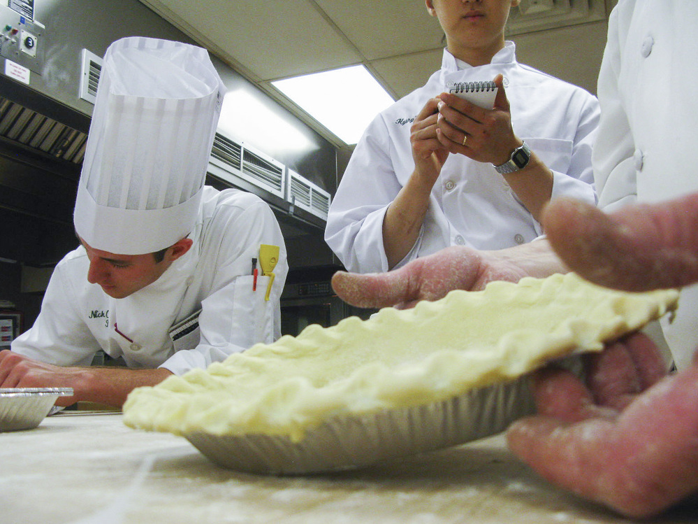 Would-be chefs take notes as CIA Instructor George Higgins demonstrates perfect pie crust.