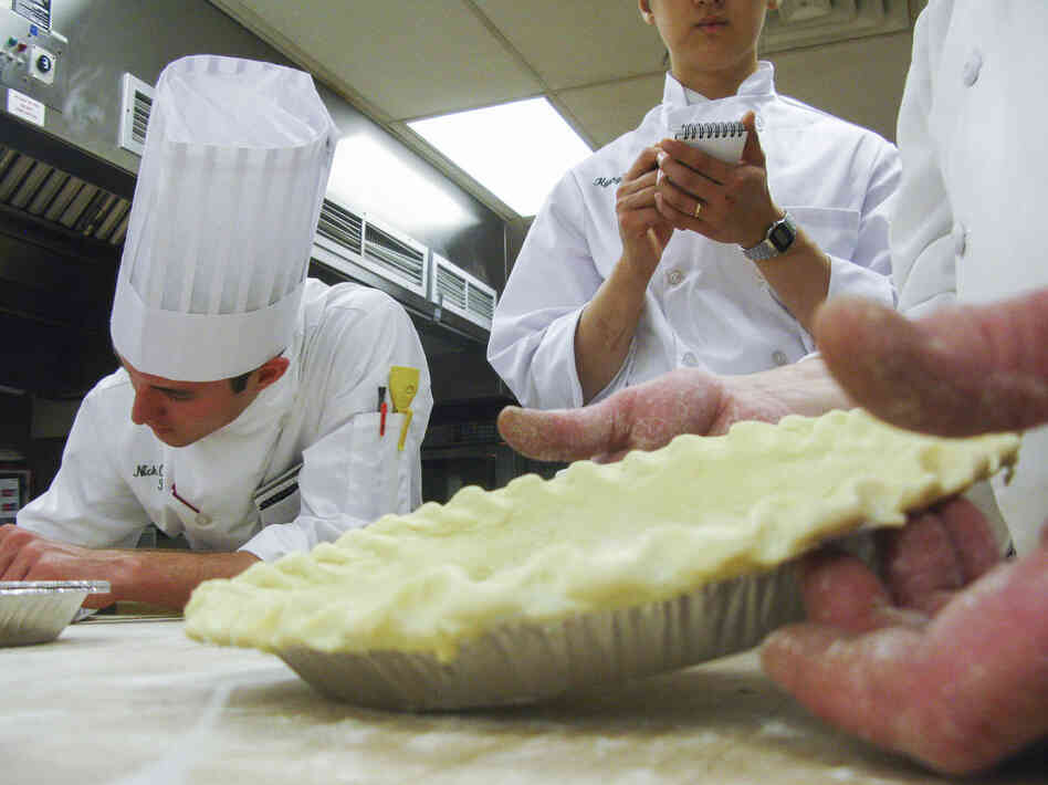 Would-be chefs take notes as CIA Instructor George Higgins demonstrates perfect pie crust.