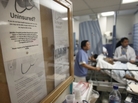 A bulletin board in New York's Jamaica Hospital offers advice for uninsured patients. A bulletin board in New York's Jamaica Hospital offers advice for uninsured patients.