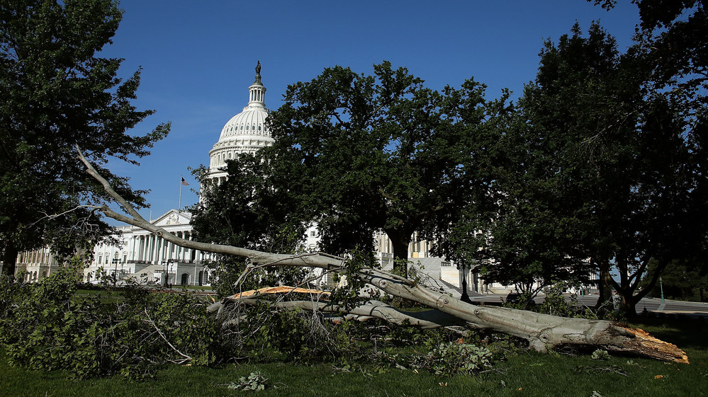 Branches and power lines littered the nation's capital after bruising storms swept through the Mid-Atlantic region on Friday night.