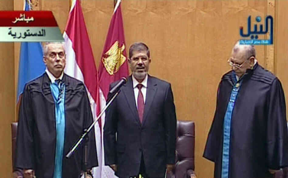 An image grab taken from Egypt's Nile TV shows Egyptian President Mohamed Morsi (center) taking the oath of office during the official swearing-in ceremony at the Constitutional Court in Cairo on Saturday.