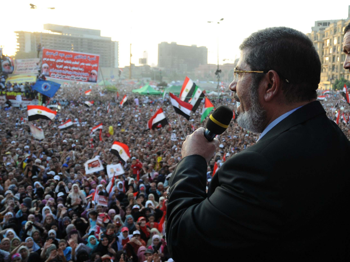 In this handout picture made available by the Egyptian presidency, Egypt's Islamist president-elect Mohamed Morsi addresses tens of thousands of Egyptians in Cairo's iconic Tahrir Square on Friday.