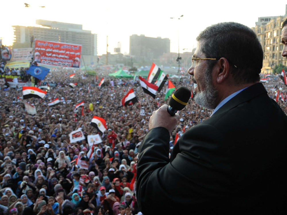 In this handout picture made available by the Egyptian presidency, Egypt's Islamist president-elect Mohamed Morsi addresses tens of thousands of Egyptians in Cairo's iconic Tahrir Square on Friday.