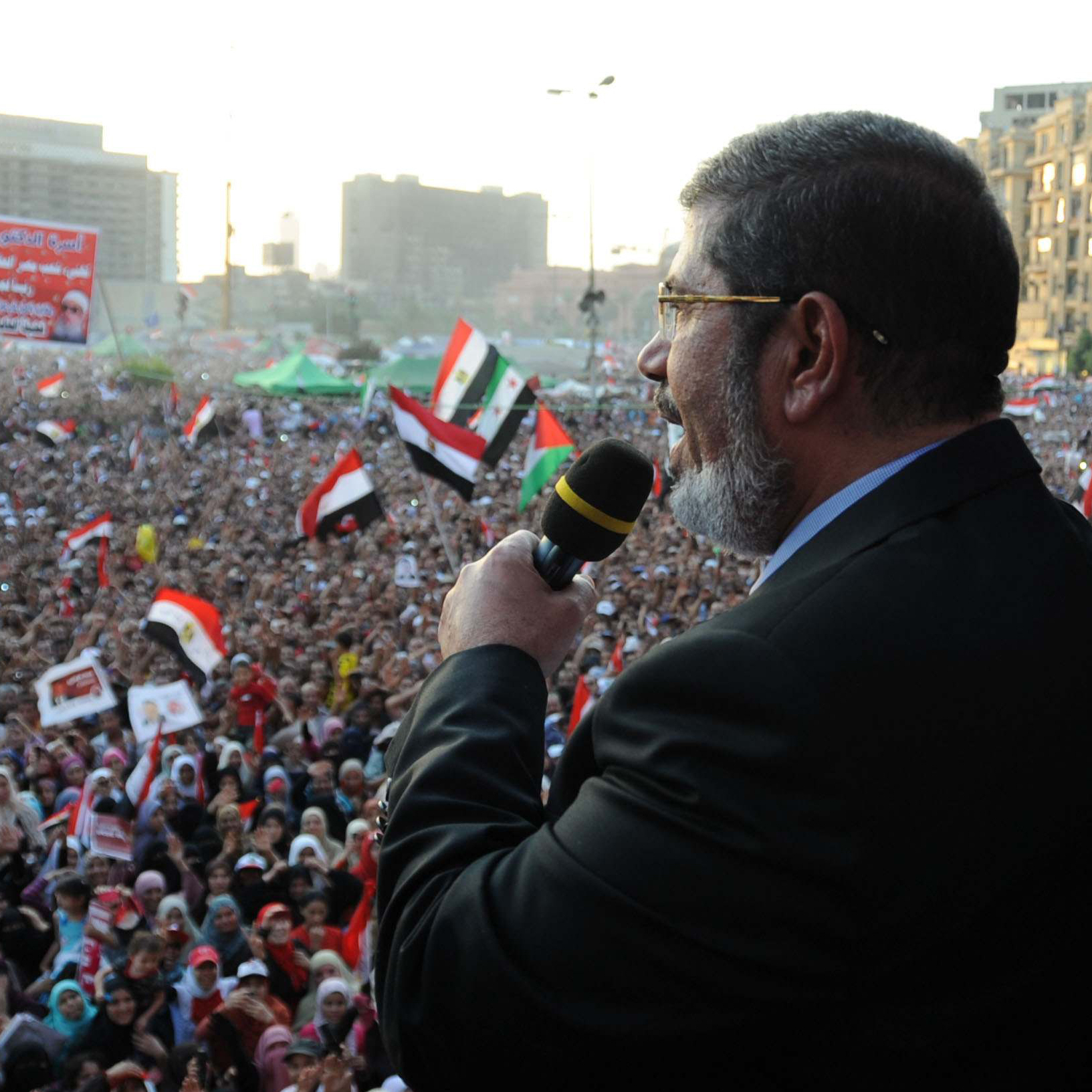 In this handout picture made available by the Egyptian presidency, Egypt's Islamist president-elect Mohamed Morsi addresses tens of thousands of Egyptians in Cairo's iconic Tahrir Square on Friday.