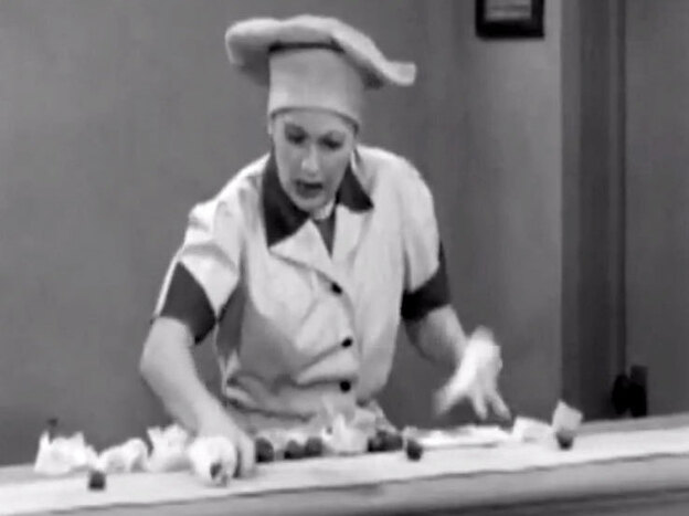 In a famous scene from I Love Lucy, Lucille Ball fights a losing battle.