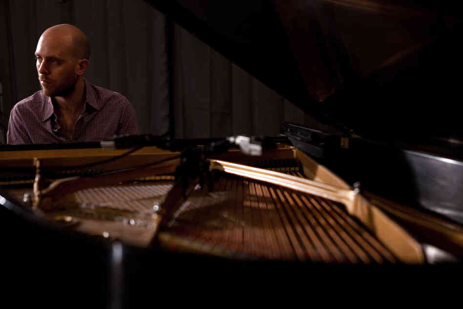 Jason Lindner listens intently as he plays the Steinway.
