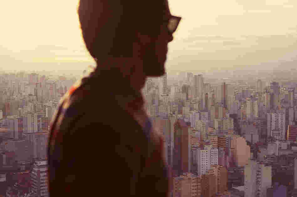 "A man in front of the countless skyscrapers of Sao Paulo. Loneliness."