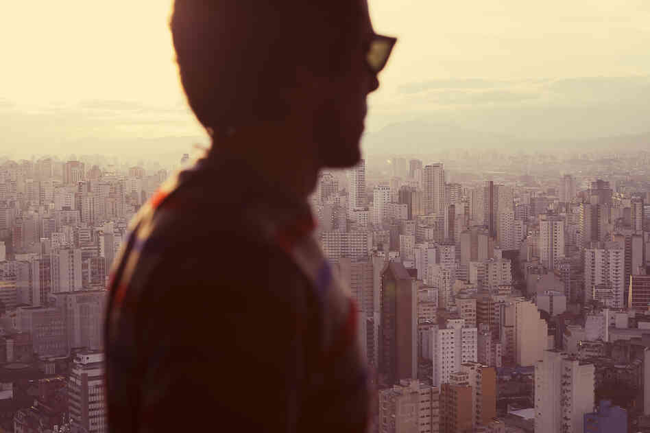 "A man in front of the countless skyscrapers of Sao Paulo. Loneliness."