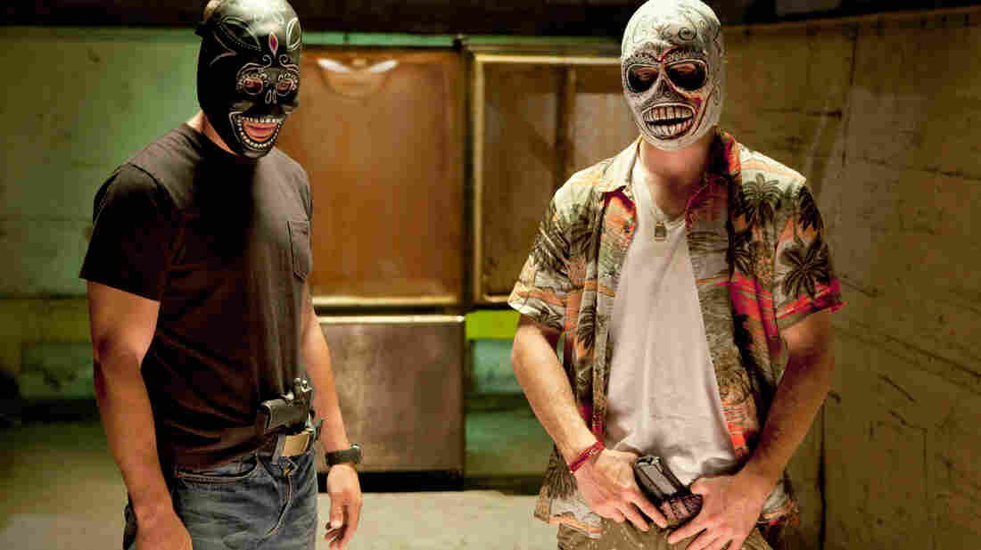 In Savages, two drug dealers — Chon (Taylor Kitsch, left), a former Navy SEAL, and Ben (Aaron Johnson), a pacifist — are forced to take up arms when they anger the head of a Mexican cartel. In Savages, two drug dealers — Chon (Taylor Kitsch, left), a former Navy SEAL, and Ben (Aaron Johnson), a pacifist — are forced to take up arms when they anger the head of a Mexican cartel.