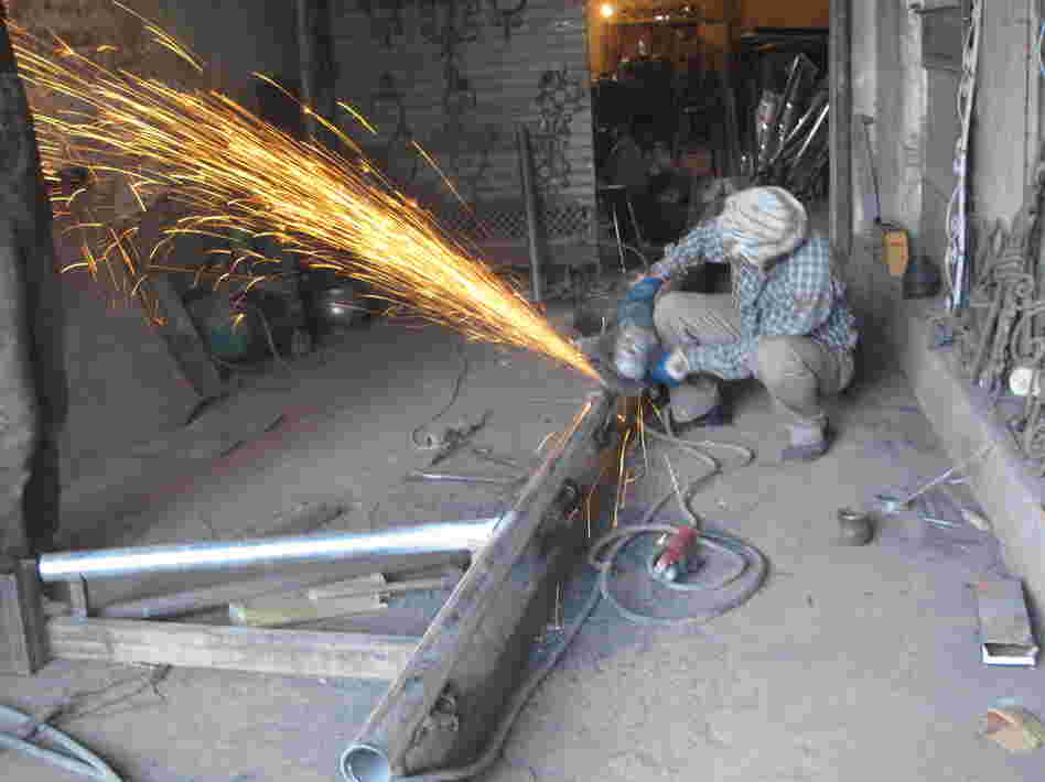 This welding shop in Kabul relies on a generator because the city power supply isn't reliable or powerful enough for the equipment.