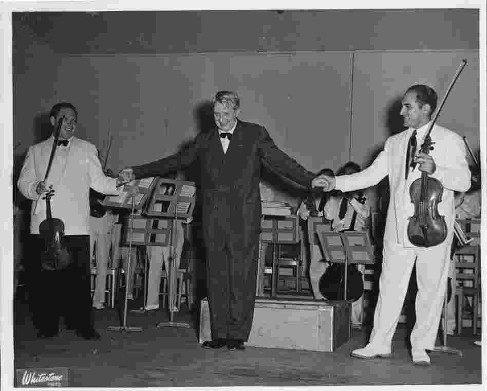 Undated: Conductor Charles Munch takes a bow with violinist Isaac Stern and BSO prinicipal violist Joseph de Pasquale.