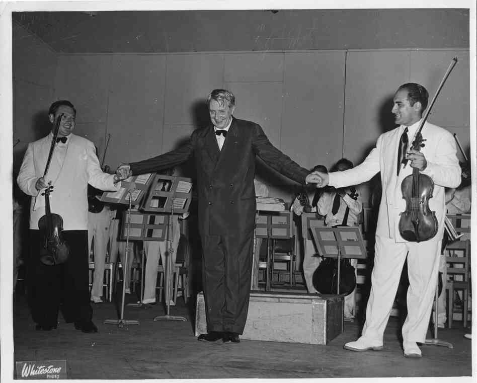 Undated: Conductor Charles Munch takes a bow with violinist Isaac Stern and BSO prinicipal violist Joseph de Pasquale.