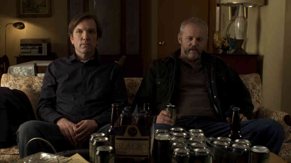 Robert (Martin Donovan, left), a writer in need of inspiration, sits with his uncultured kidnapper, Gus (David Morse), in Collaborator. Donovan also wrote and directed the film. Robert (Martin Donovan, left), a writer in need of inspiration, sits with his uncultured kidnapper, Gus (David Morse), in Collaborator. Donovan also wrote and directed the film.