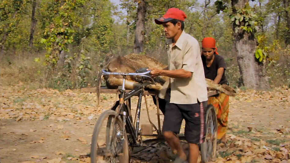 Workers serve a goat at a Jatayu restaurant or vulture restaurant.