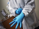 A dentist dons sterile gloves at a community health center on March 27, 2012 in Aurora, Colo. The center has received some 6,000 more Medicaid eligable patients since the passage of health care reform. Expansion of such clinics is key to serving the millions more patients set to be be covered by Medicaid under the Affordable Care Act. A dentist dons sterile gloves at a community health center on March 27, 2012 in Aurora, Colo. The center has received some 6,000 more Medicaid eligable patients since the passage of health care reform. Expansion of such clinics is key to serving the millions more patients set to be be covered by Medicaid under the Affordable Care Act.