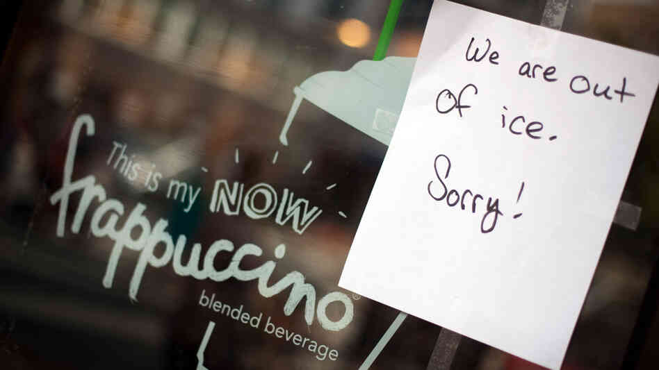 Sign of the times: In Bethesda, Md., a Starbucks breaks some bad news. Ice is in short supply in many places where the power is out.