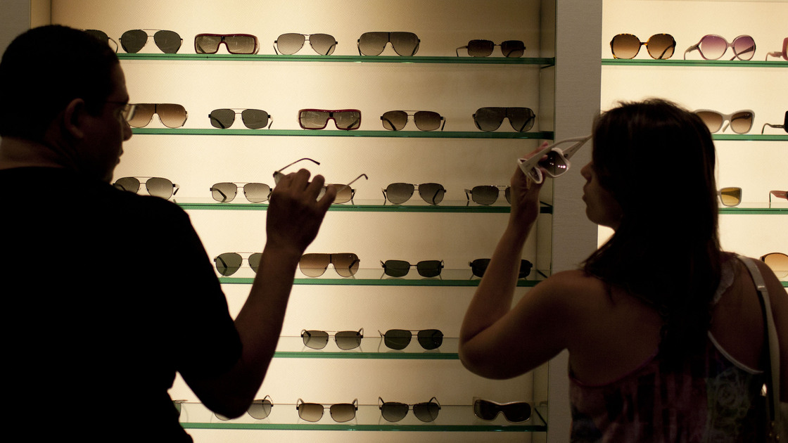 Brazilian shoppers try on sunglasses at a store in Fort Lauderdale, Fla., in March.