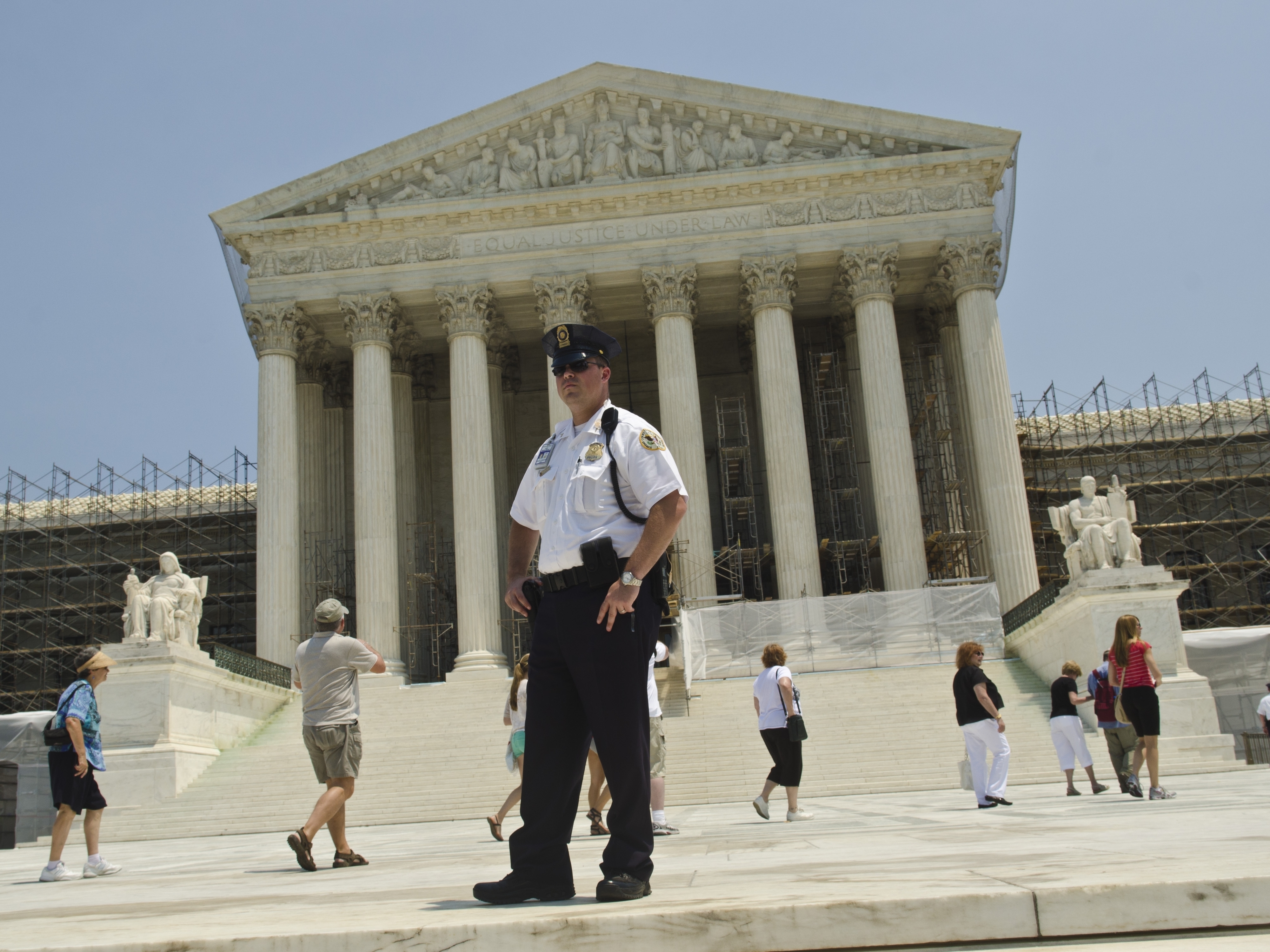 A Supreme Court Police officer stands outside the U.S. Supreme Court on June 28, 2012 in Washington, D.C.