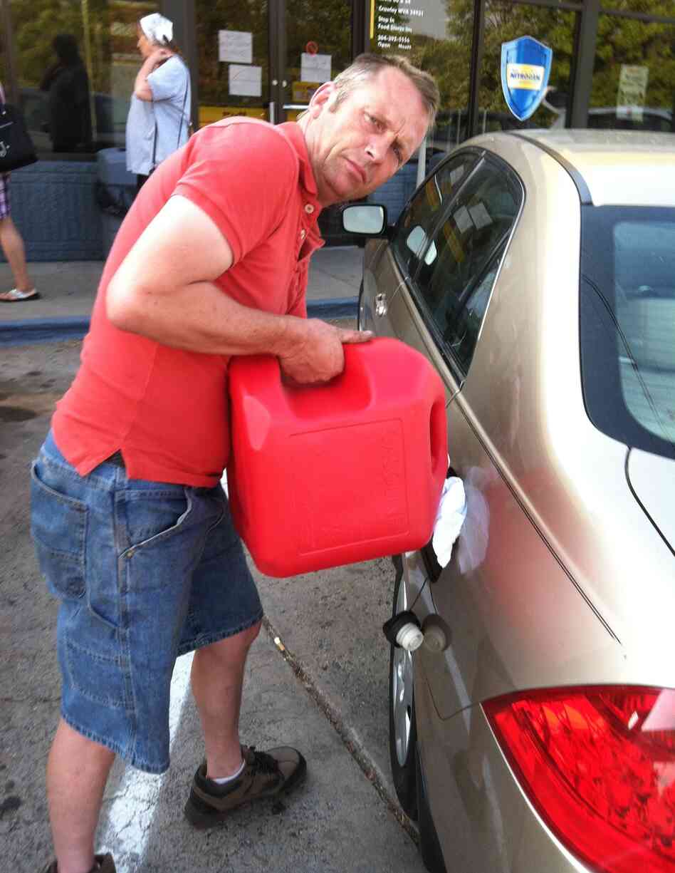 Trucking company owner Tod Moss, who lives in the town of Beckley, drove 40 miles to Crawley to bring a few gallons of gas to his employees. "You could get beat up and killed for 5 gallons of gas," he says. Trucking company owner Tod Moss, who lives in the town of Beckley, drove 40 miles to Crawley to bring a few gallons of gas to his employees. "You could get beat up and killed for 5 gallons of gas," he says.