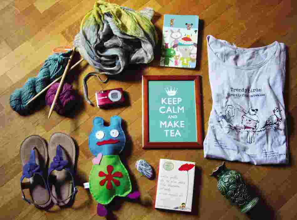 Cristina Cavallari, 43, Italy, crafter/graphic designer: "My family cat (not pictured), wool and wood knitting needles ... my best t-shirt, blue comfortable sandals ... felt monster I made, sea rock from my father ... old German vase."