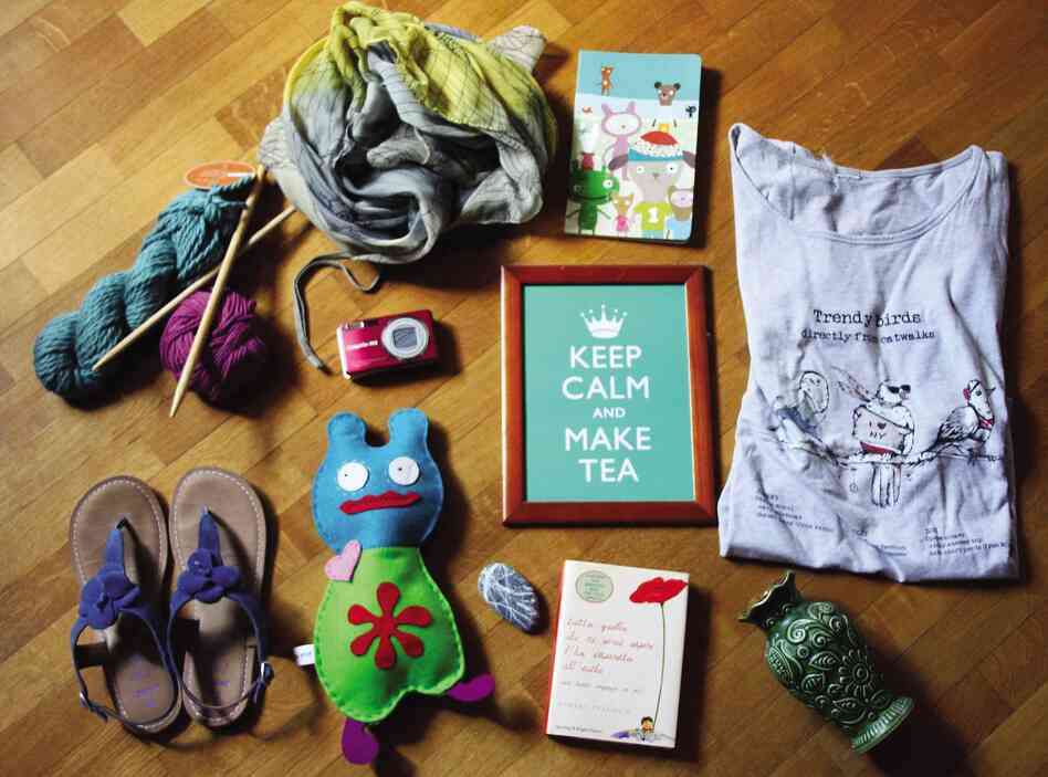 Cristina Cavallari, 43, Italy, crafter/graphic designer: "My family cat (not pictured), wool and wood knitting needles ... my best t-shirt, blue comfortable sandals ... felt monster I made, sea rock from my father ... old German vase."