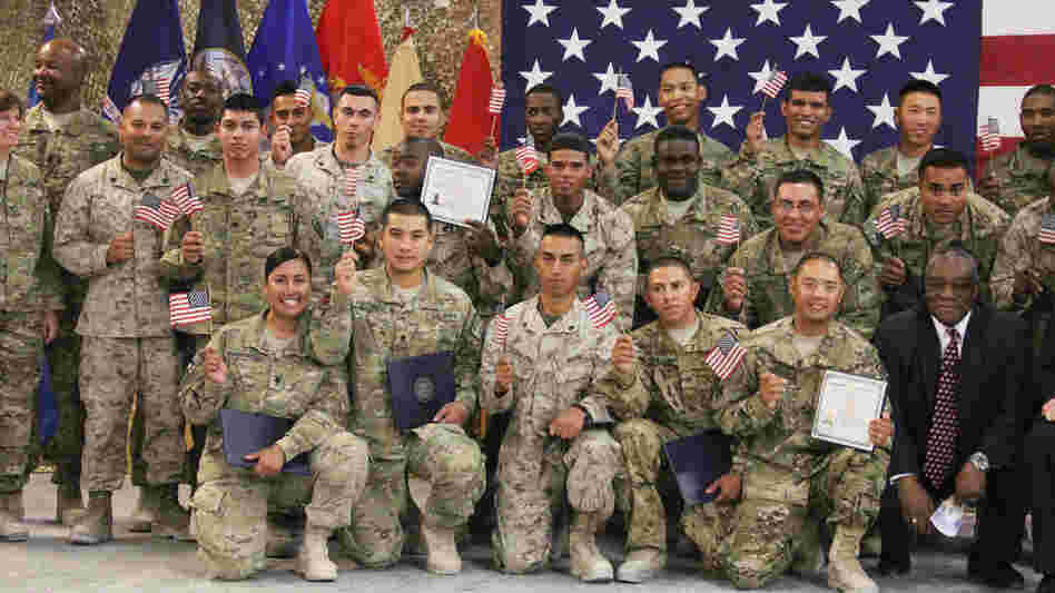 U.S. soldiers and Marines pose after being sworn in as U.S. citizens in a service at Kandahar Air Field in Afghanistan on Friday.