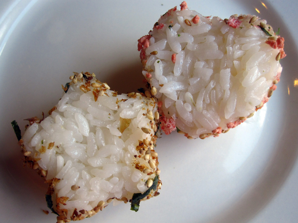 Leftover rice can be pressed into shapes; the sides are rolled in furikake seasoning.