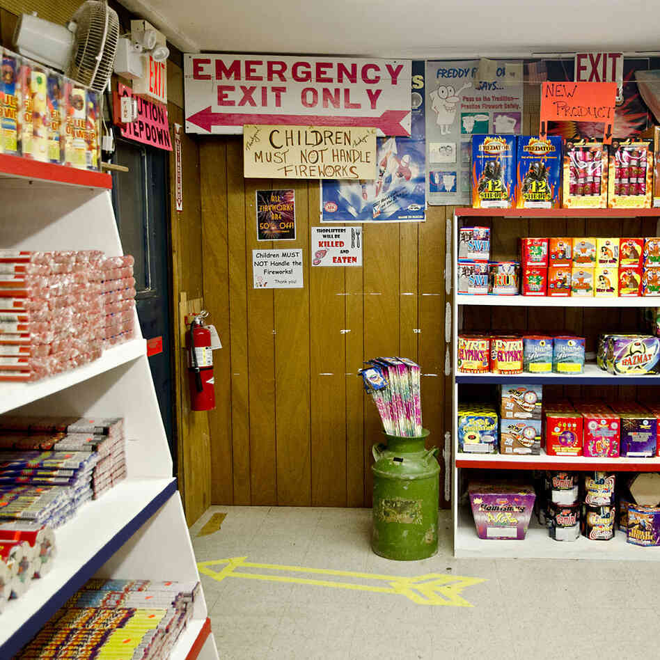 Emergency Exit. Convoy, Ohio. I was taking a photograph of a fireworks store sign on Route 30 just past the Indiana border when the owner of the store ran up to our car and asked if we could give his truck a jump-start. ... After doing our good deed, we got a tour of the store, a look at some of the "professional" grade explosives, and a discount to boot.