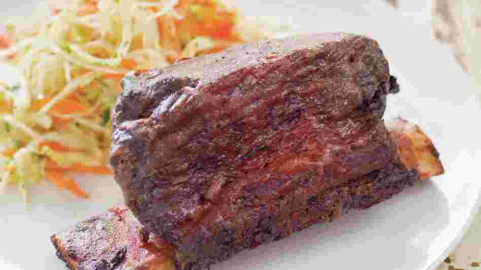 Grilled short ribs are a delicious addition to any summer barbecue. Grilled short ribs are a delicious addition to any summer barbecue.