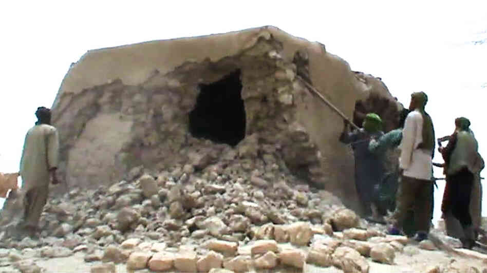This image from a video shows Islamist militants destroying an ancient shrine in Timbuktu on Sunday.