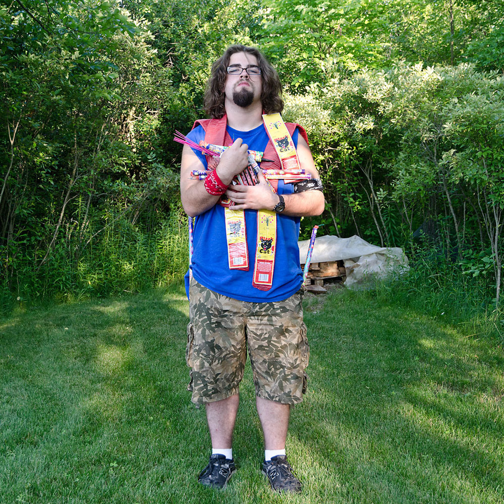 Chris and his Stash. Grand Island, N.Y. My son with most of the fireworks he purchased during our 3,500-mile fireworks store road trip. ... We managed to set off about half of his stash that night.