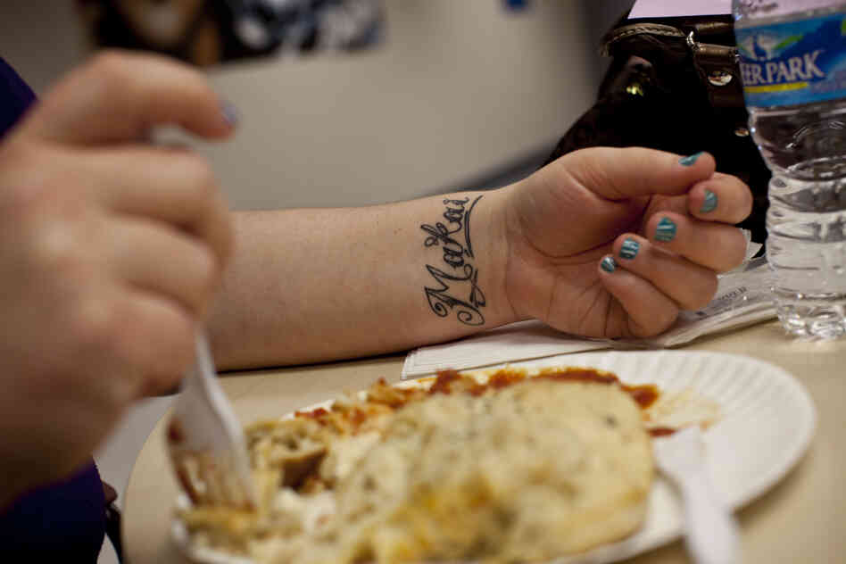 Stepp sports a tattoo of her younger son's name, Makai, on her wrist. I-LEAD, the nonprofit that runs her evening classes, provides dinner for its students.