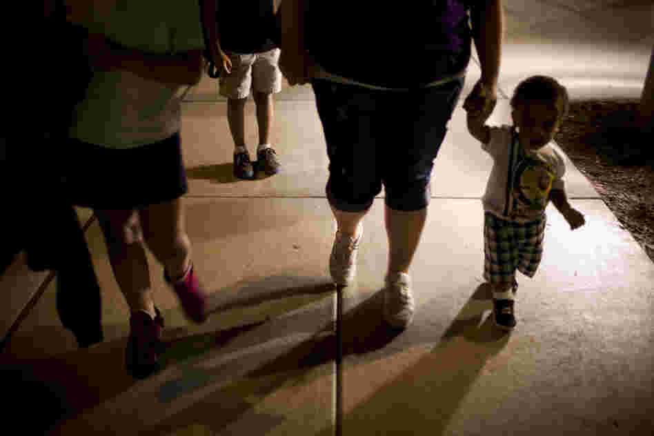 Stepp picks up her three children, (from left) Shyanne, 8; Isaiah, 10; and Makai, 1, at the 24-hour day care center after her classes are over around 9 p.m.