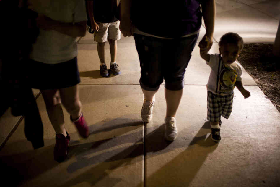 Stepp picks up her three children, (from left) Shyanne, 8; Isaiah, 10; and Makai, 1, at the 24-hour day care center after her classes are over around 9 p.m.