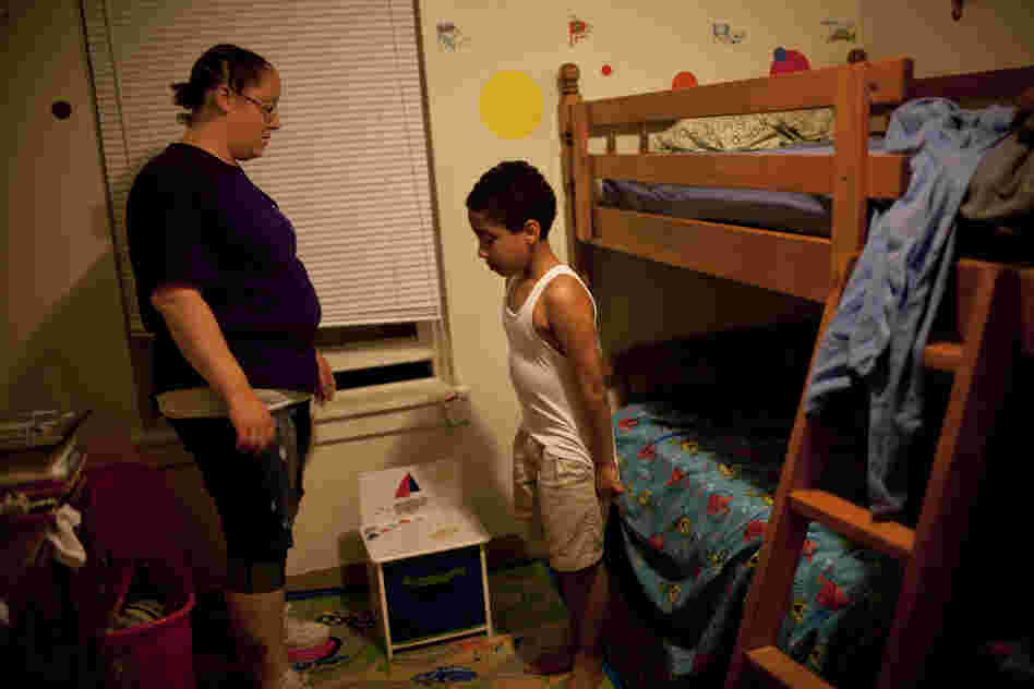 Stepp speaks to Isaiah before bedtime. "Sometimes I think I have done something wrong for them to turn their backs to me," she says of her failed relationships with her children's fathers. "But then there are other times that I'm in a good mood and think, 'Oh, well. Let them go. If they don't want to do it, I can do it. I can be the mother and father at the same time.' "