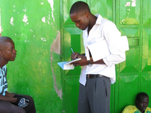 A health worker in western Kenya talks to young men about the benefits of male circumcision. A health worker in western Kenya talks to young men about the benefits of male circumcision.