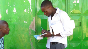 A health worker in western Kenya talks to young men about the benefits of male circumcision.