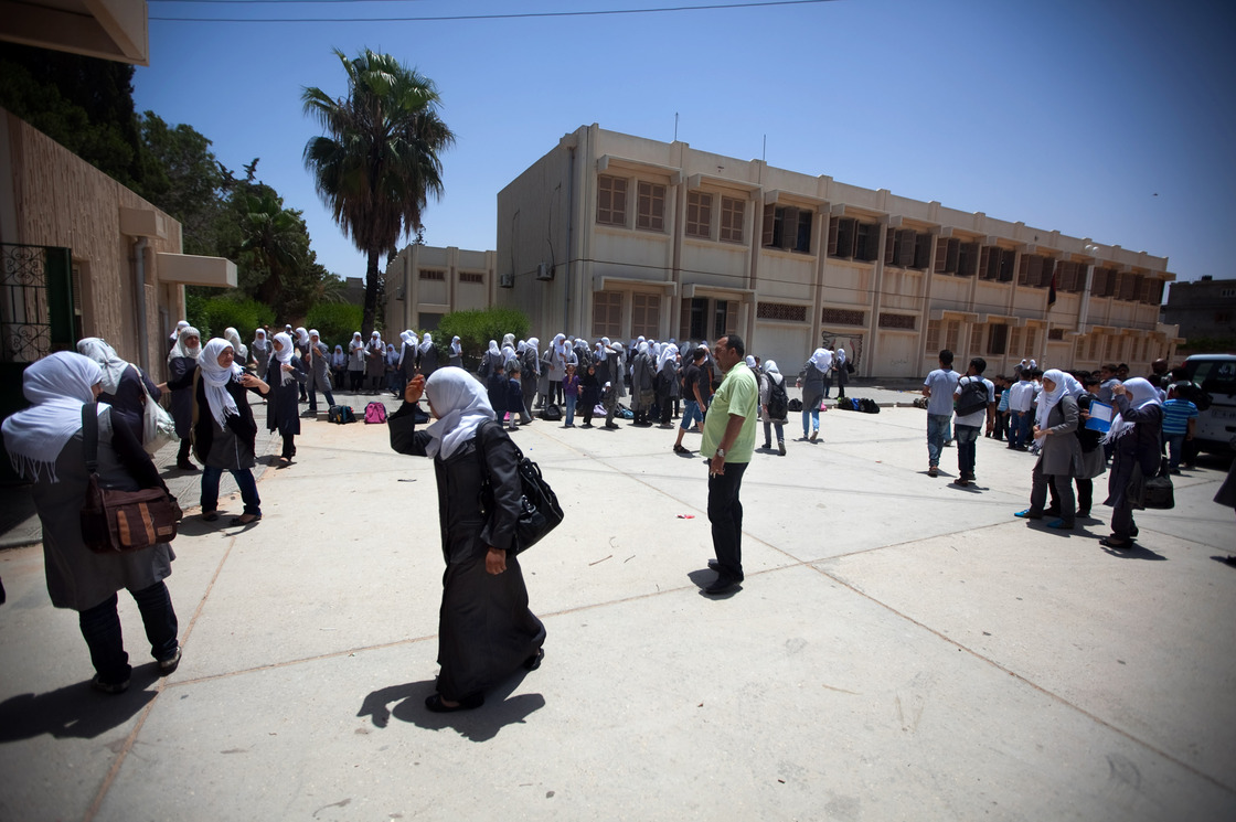 Schoolgirls outside the Martyrs of Libya school near Leptis Magna, Libya. The country's history books are being rewritten, and Gadhafi's rule is now described as a time of corruption and atrocities.