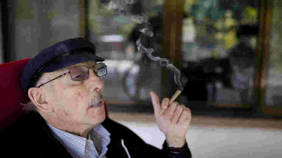 Moshe Rute smokes cannabis at the Hadarim nursing home in Kibutz Naan, Israel. In conjunction with Israel's Health Ministry, the Tikkun Olam company is distributing cannabis for medicinal purposes to more than 1,800 people in Israel.