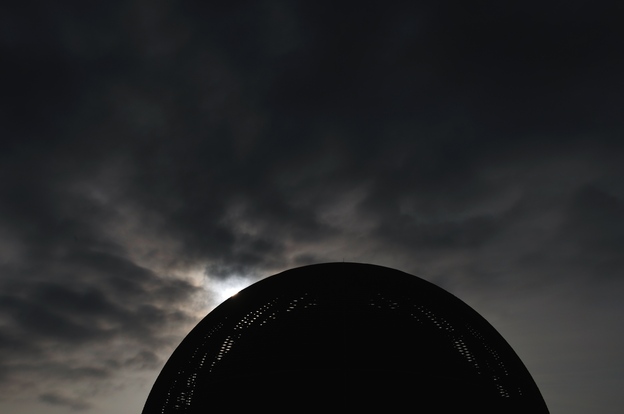 A new day dawning on humanity: the sun rises behind The Globe of Science and Innovation at CERN on July 4, 2012.