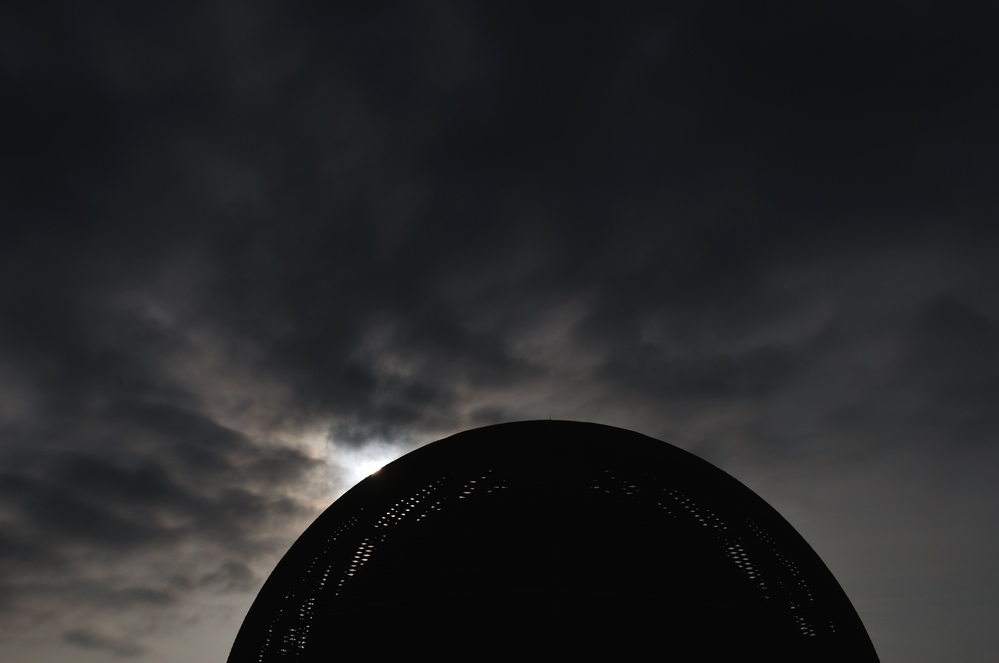 A new day dawning on humanity: the sun rises behind The Globe of Science and Innovation at CERN on July 4, 2012.