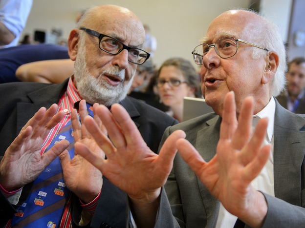 British physicist Peter Higgs (right), who proposed the Higgs boson in the 1960s, speaks with Belgium physicist Francois Englert at Wednesday's event.